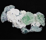 Кристаллы зеленого и фиолетового флюорита на породе 105 грамм 