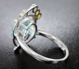 Серебряное кольцо с голубым топазом и зелеными сапфирами