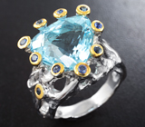 Серебряное кольцо с голубым топазом 14,35 карата и синими сапфирами