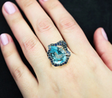 Серебряное кольцо с голубым топазом 11,05 карата и синими сапфирами