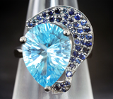 Серебряное кольцо с голубым топазом лазерной огранки 9,61 карата и синими сапфирами