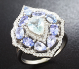 Серебряное кольцо с голубым топазом и танзанитами