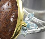 Серебряное кольцо с рутиловым кварцем и голубыми топазами