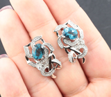 Ажурные серебряные серьги с насыщенно-синими топазами