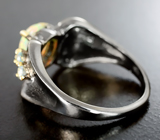 Серебряное кольцо c кристаллическим эфиопским опалом и голубыми топазами