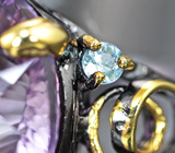 Серебряное кольцо с аметистом лазерной огранки 21,03 карата и голубыми топазами Серебро 925