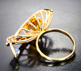 Золотое кольцо с ярким гелиодором авторской огранки 4,61 карата, синим сапфиром и бриллиантами высоких характеристик Золото