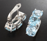 Эффектные серебряные серьги с голубыми топазами Серебро 925