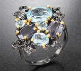 Серебряное кольцо с голубыми топазами и иолитами