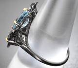 Серебряное кольцо с голубыми топазами и иолитами