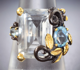 Серебряное кольцо с бесцветным кварцем, голубыми топазами и родолитом